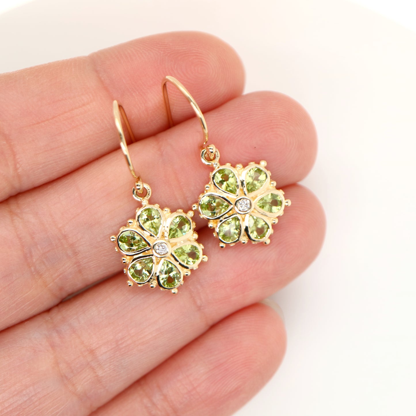 Peridot petal flower earrings with natural diamond in 9k yellow gold