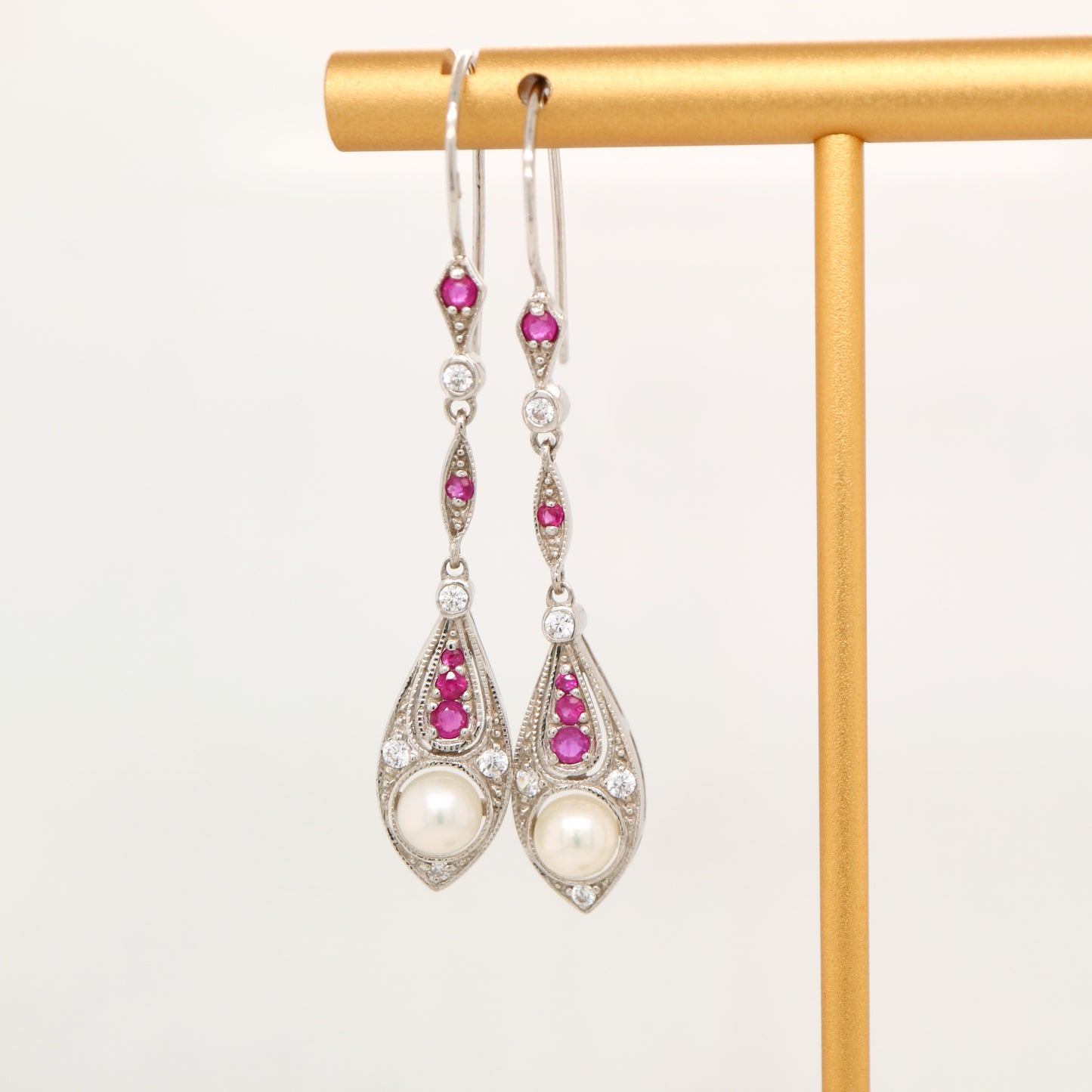 Dangle earrings with fresh water pearl, ruby and diamond in 9k white gold