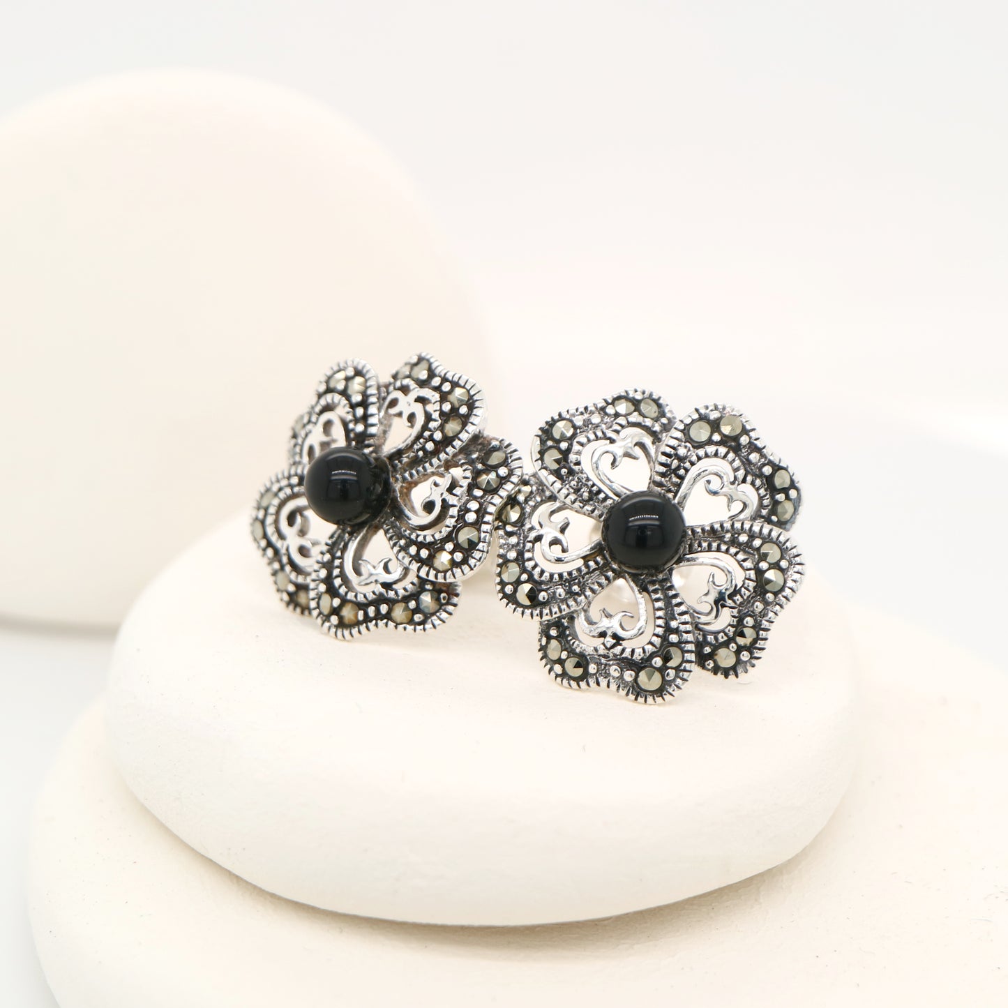 5 petal flower stud earrings with marcasite and onyx in sterling silver