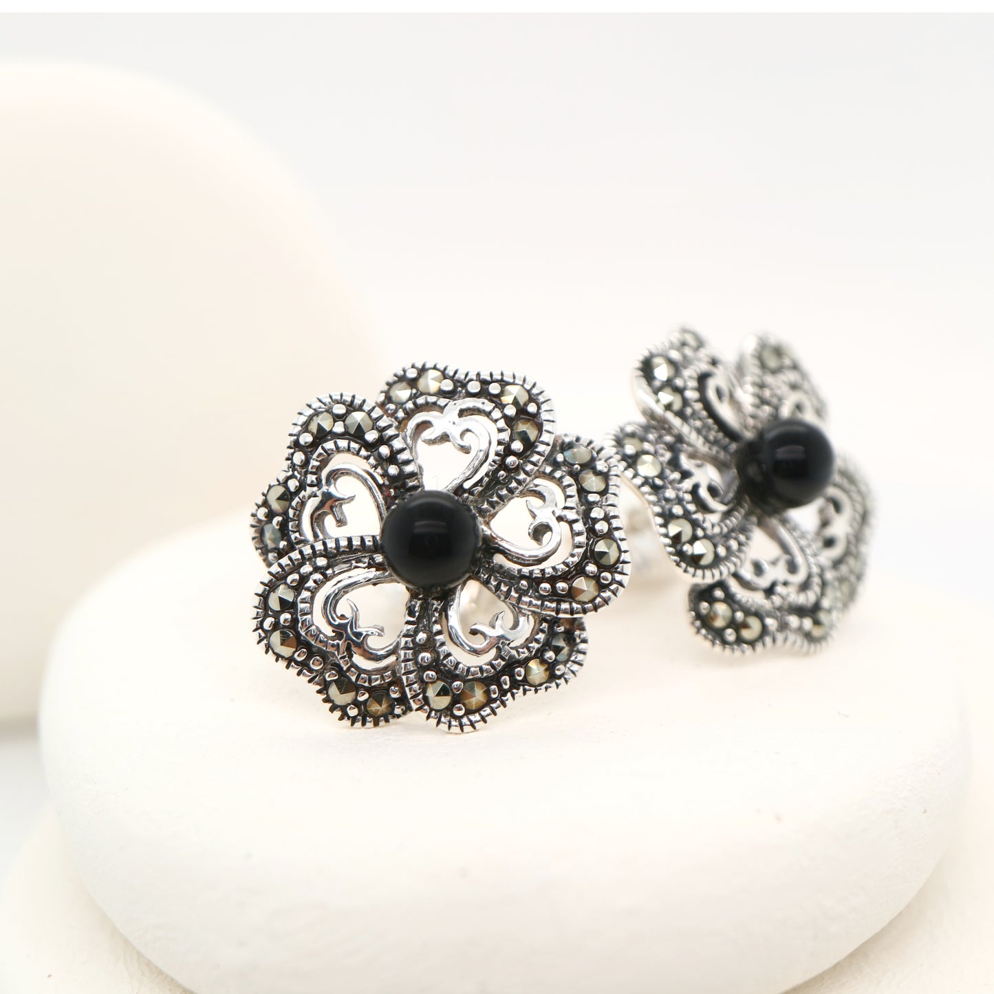 5 petal flower stud earrings with marcasite and onyx in sterling silver