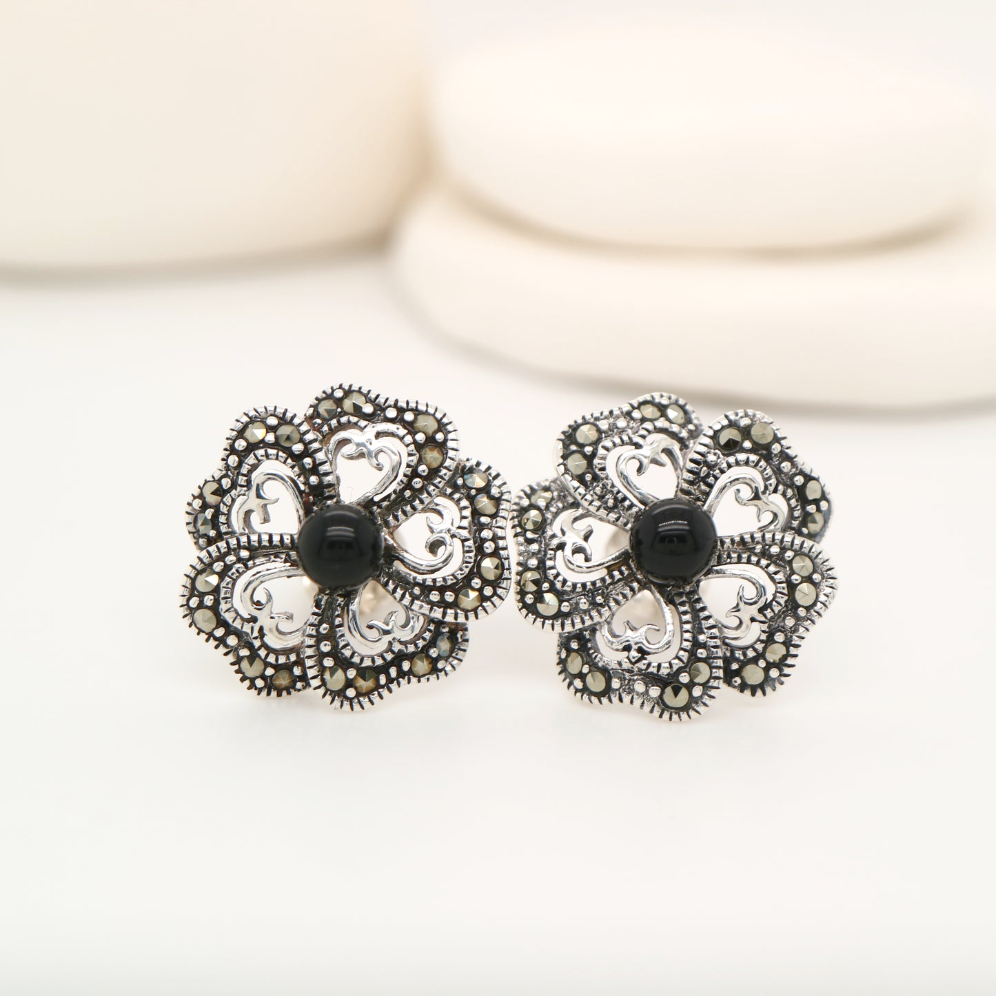 5 petal flower stud earrings with marcasite and onyx in sterling silver