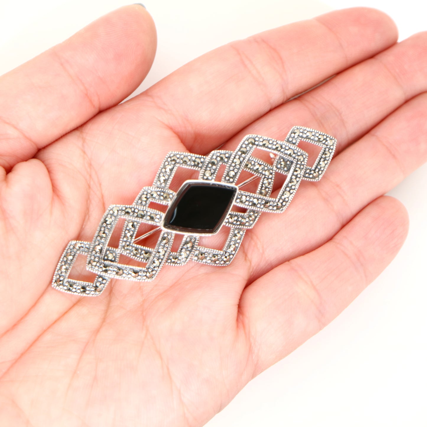 Art deco tesselated brooch with marcasite and onyx in sterling silver