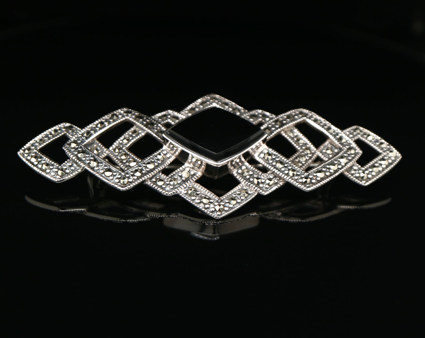 Art deco tesselated brooch with marcasite and onyx in sterling silver