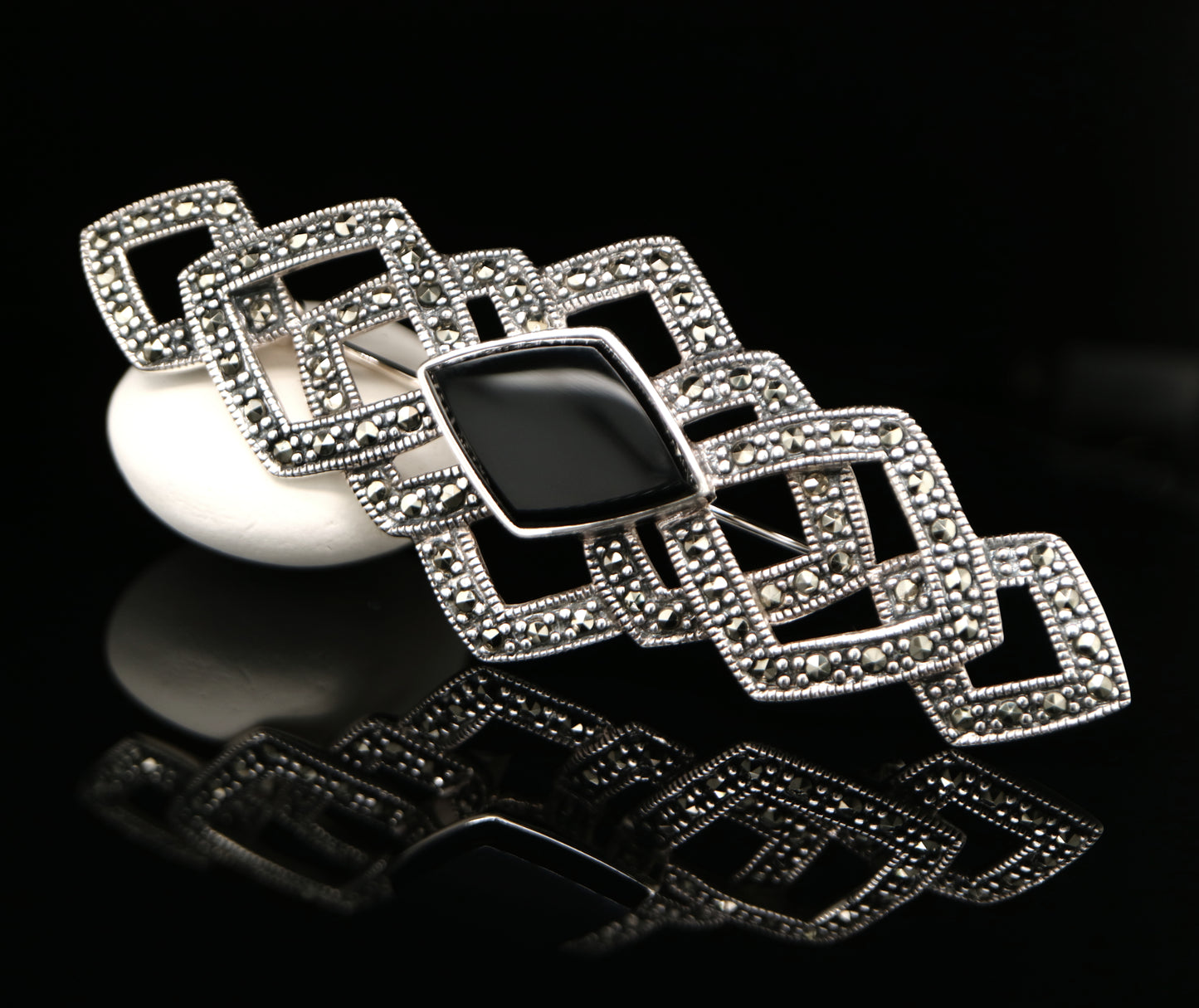 Art deco tesselated brooch with marcasite and onyx in sterling silver