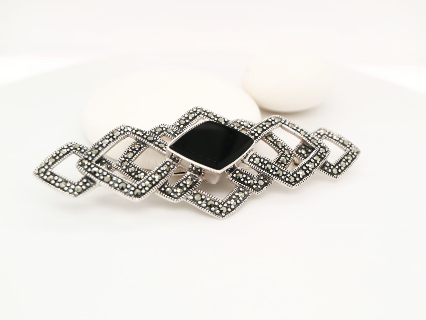 Art deco tesselated brooch with marcasite and onyx in sterling silver
