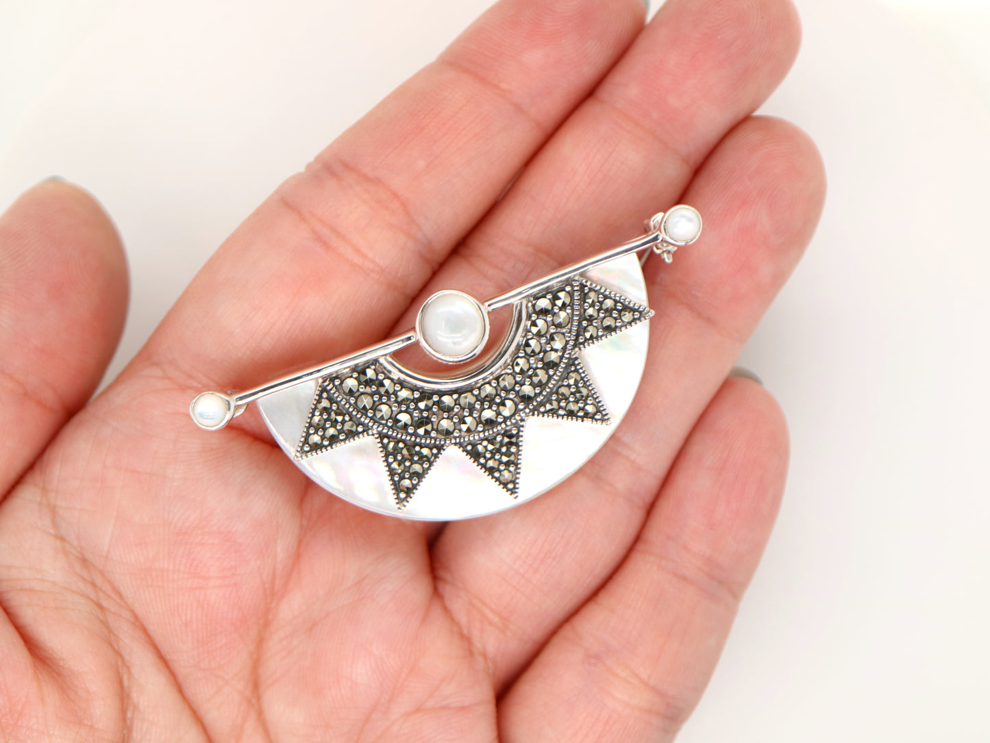 Art deco mother of pearl fan brooch with marcasite in sterling silver