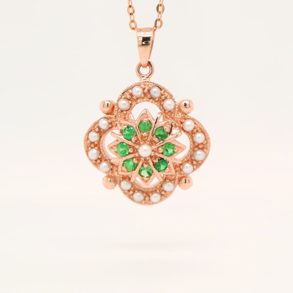 Pearl and tsavorite garnet pendant in 9k rose gold