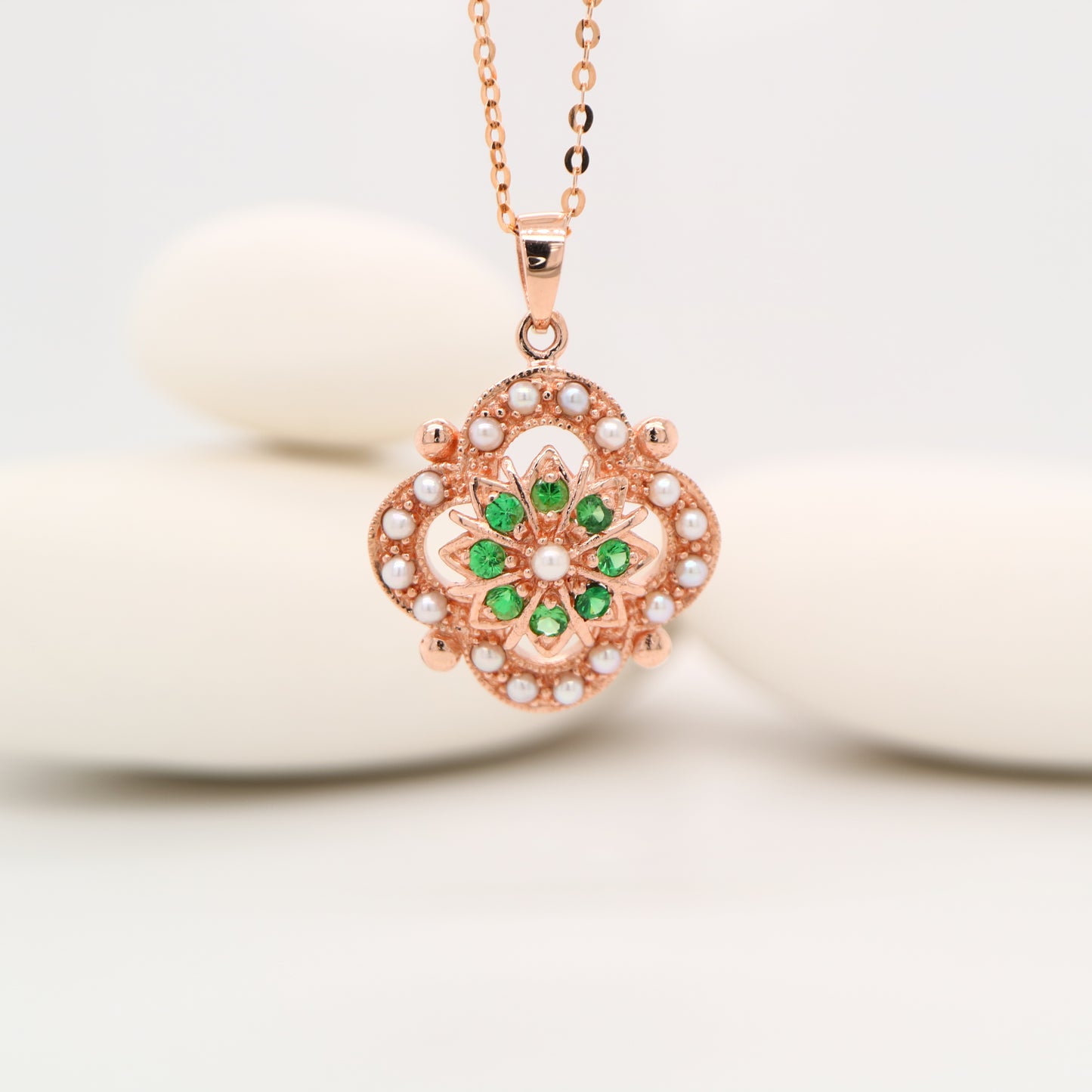 Pearl and tsavorite garnet pendant in 9k rose gold