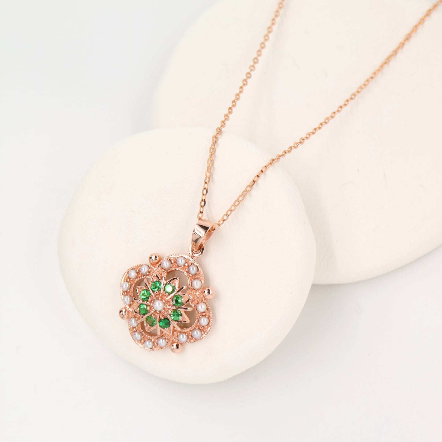 Pearl and tsavorite garnet pendant in 9k rose gold