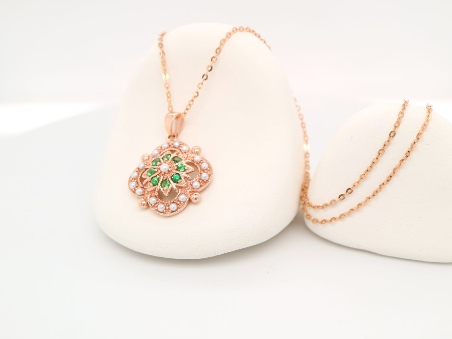 Pearl and tsavorite garnet pendant in 9k rose gold
