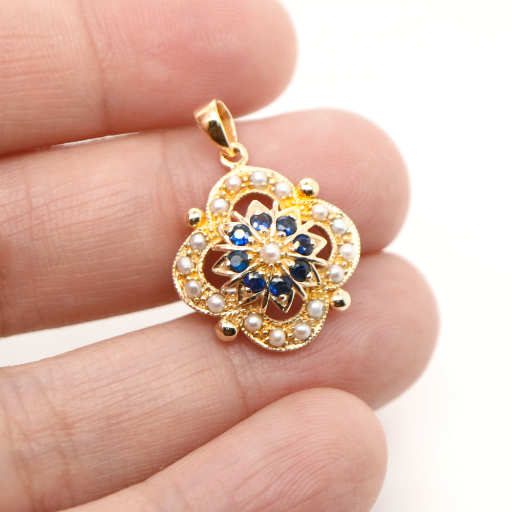 Pearl and natural sapphire pendant in 9k yellow gold