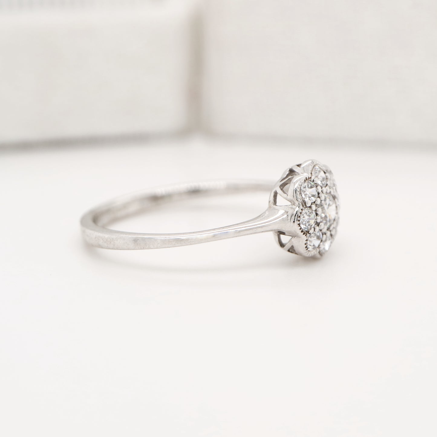 Dainty daisy diamond ring in white gold