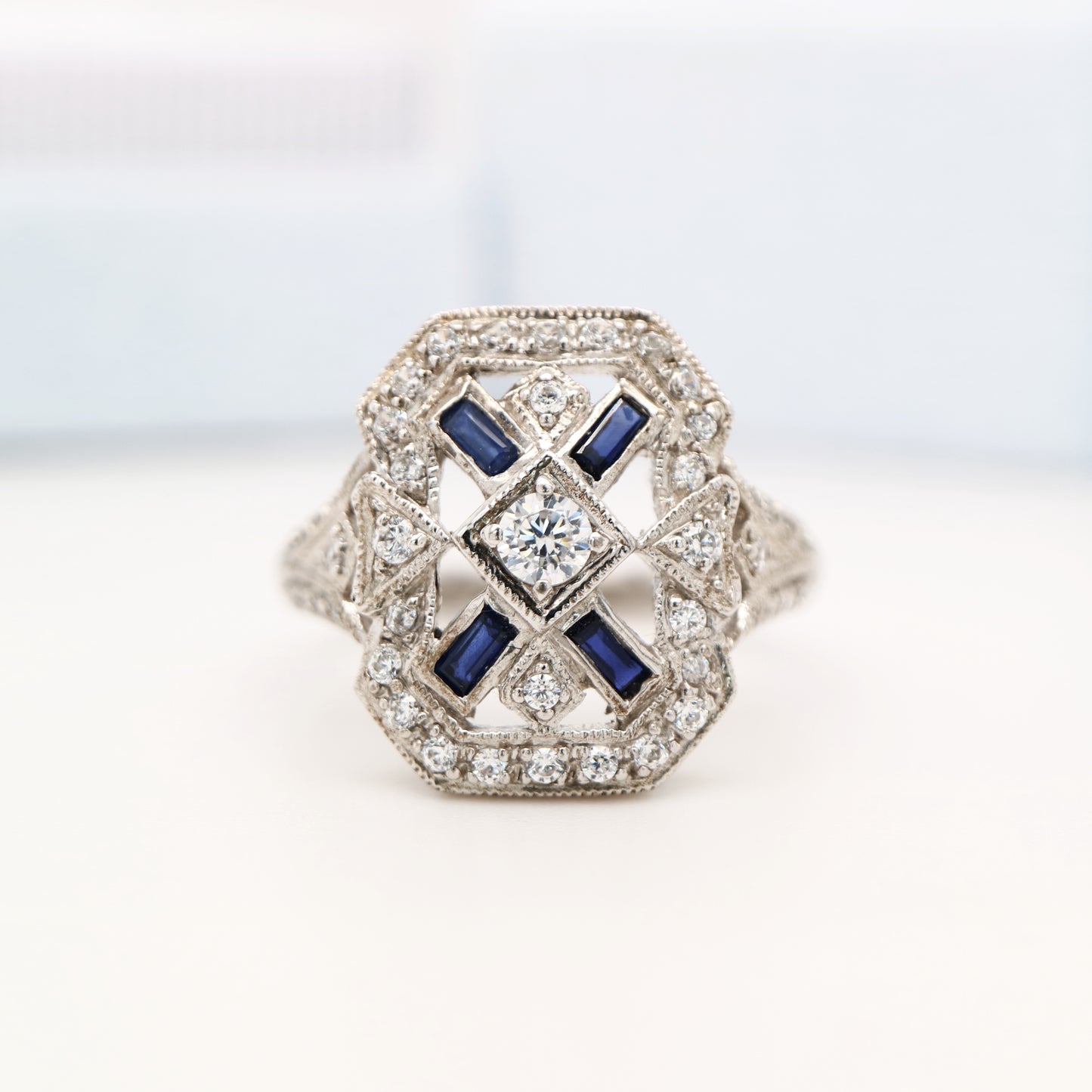 Sterling silver and cz shield ring with laboratory-grown sapphire accents