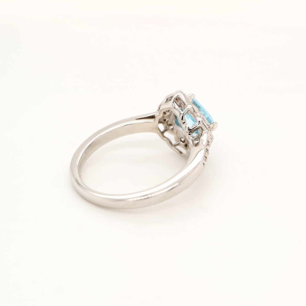 Aquamarine in 9k white gold with diamond halo