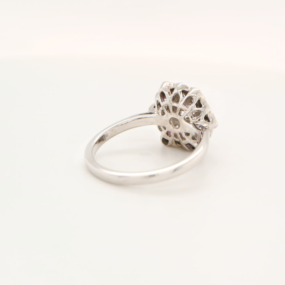Six petal ruby and diamond ring in white gold