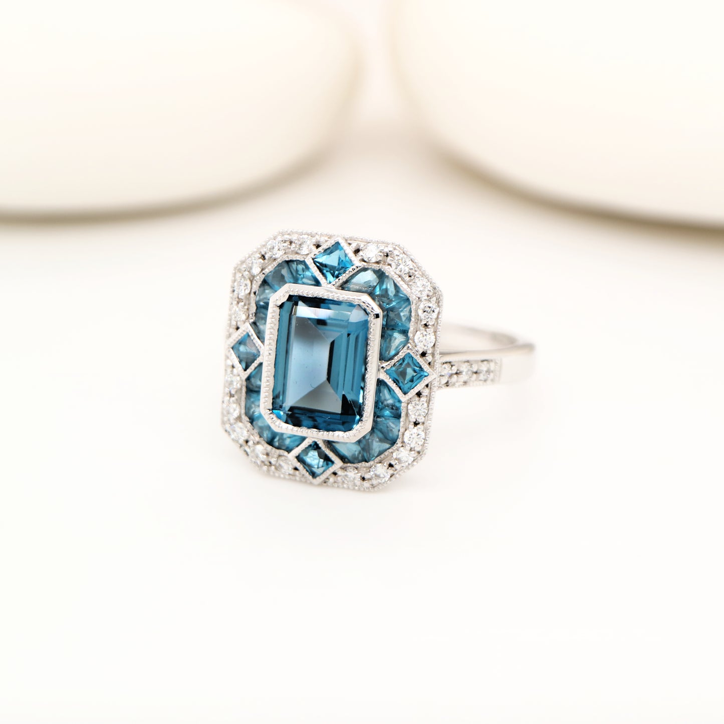 Art deco cocktail ring with london blue topaz and diamond in white gold