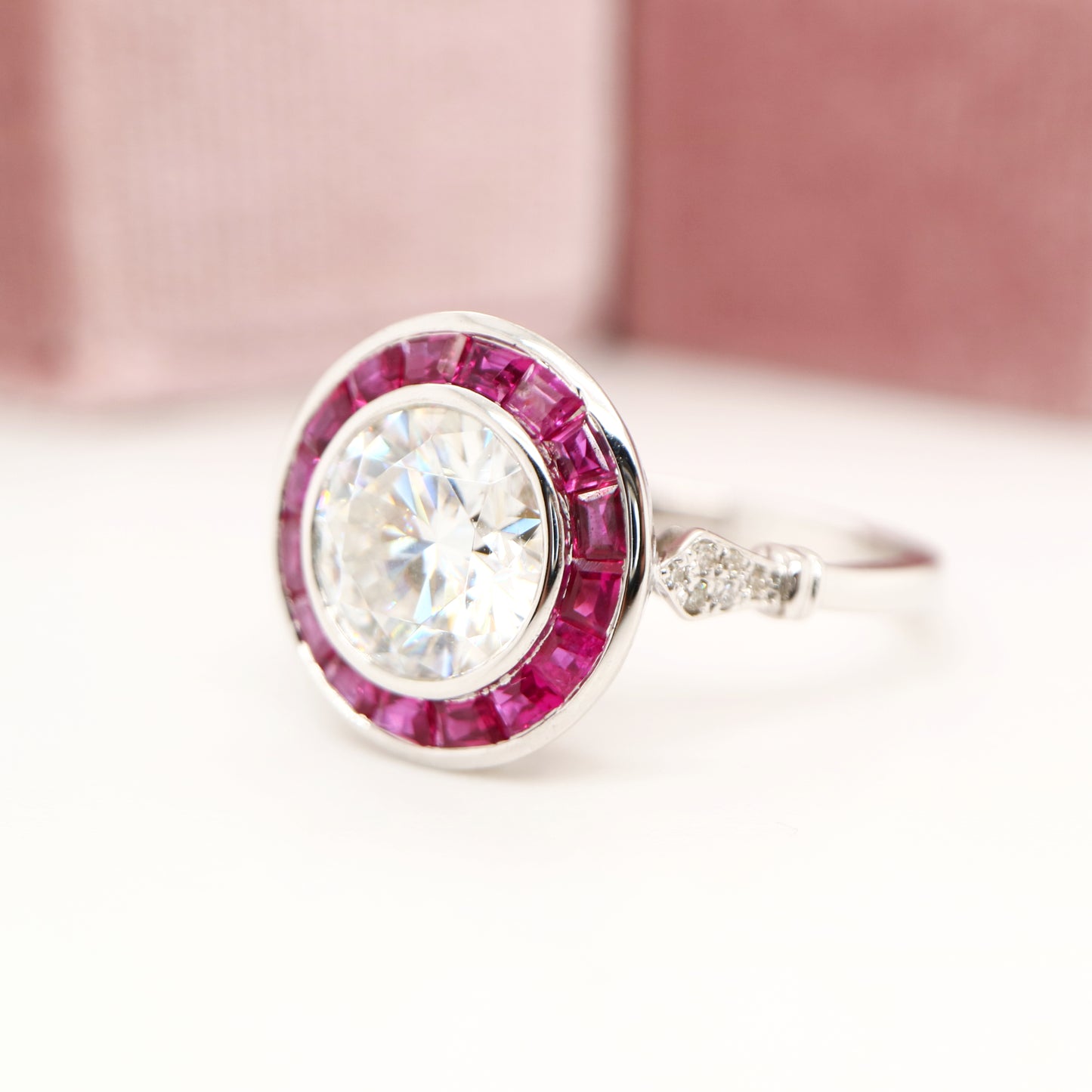 Moissanite with ruby halo ring in white gold