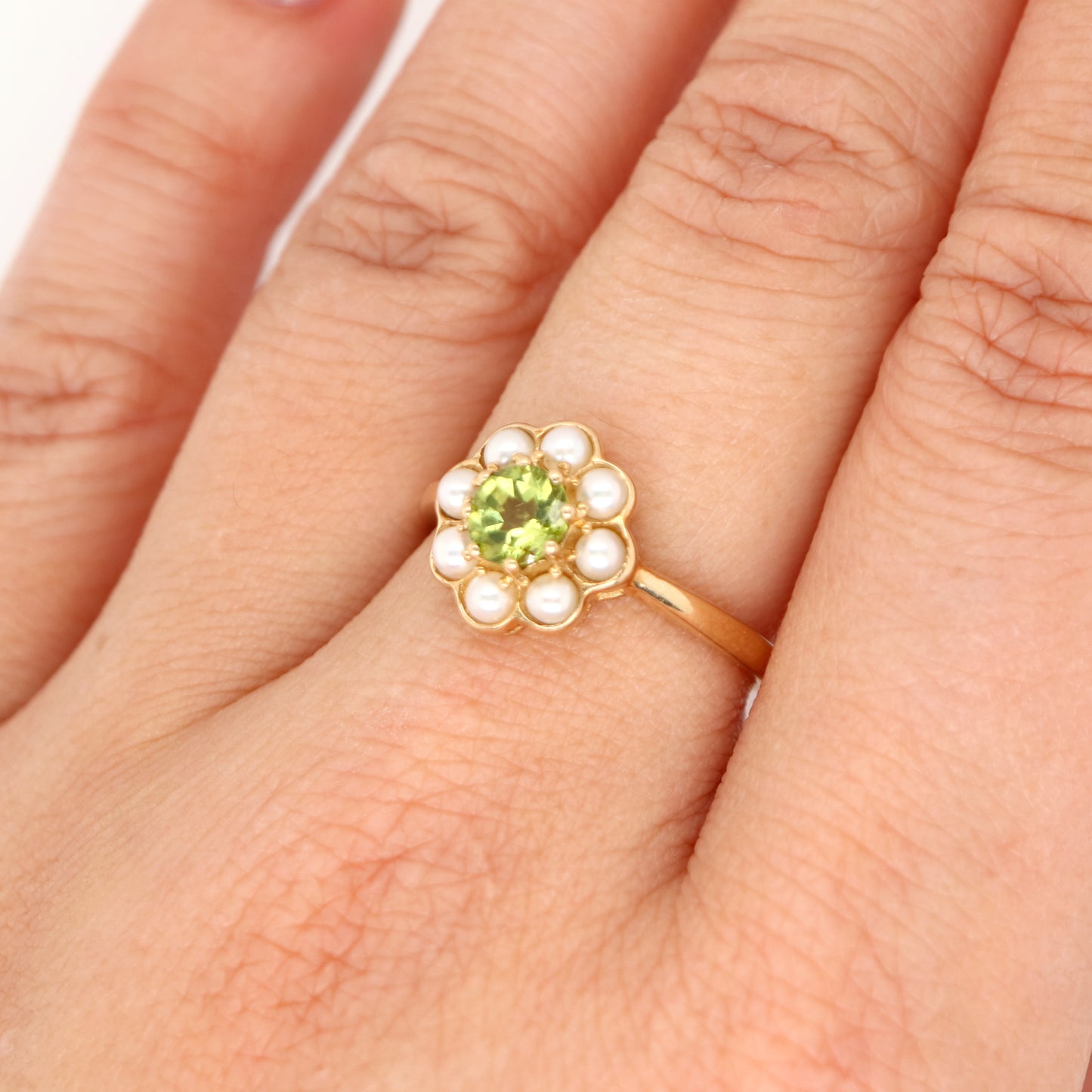 Peridot with pearl halo ring in 9k yellow gold