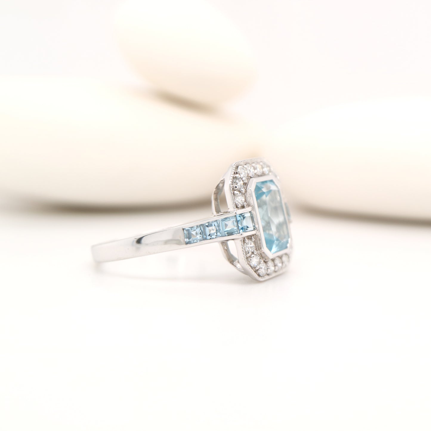 Aquamarine ring in gold with laboratory grown diamond halo