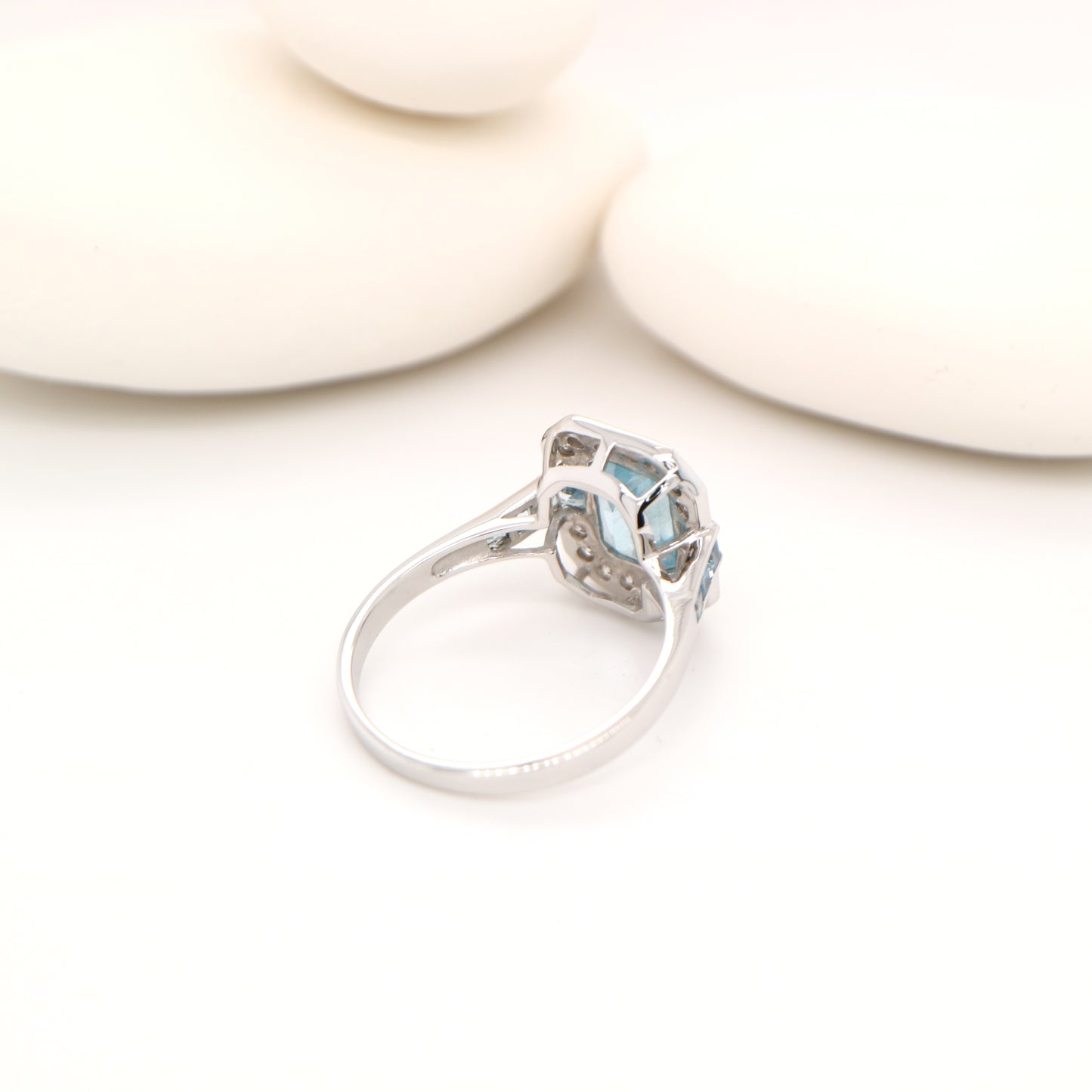 Aquamarine ring in gold with laboratory grown diamond halo