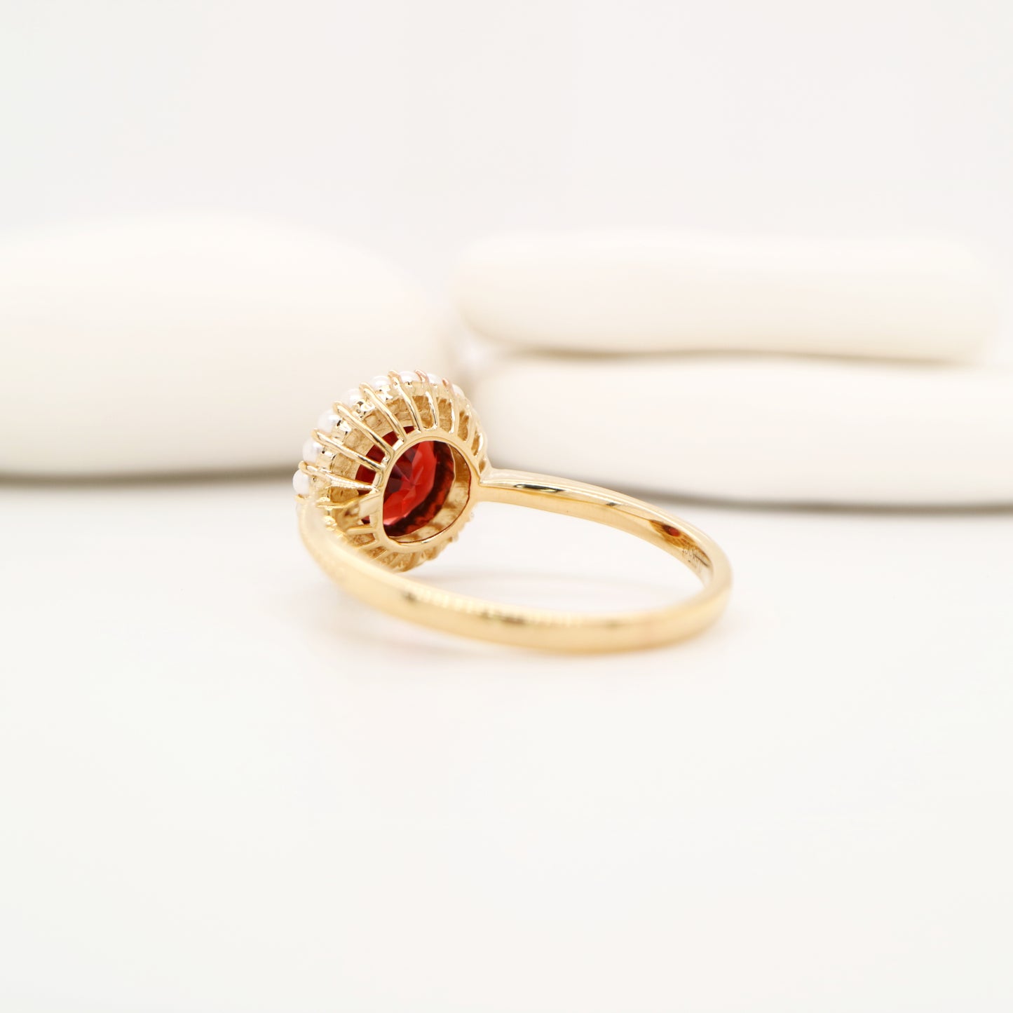 Colonial garnet filigree ring with pearl halo in yellow gold