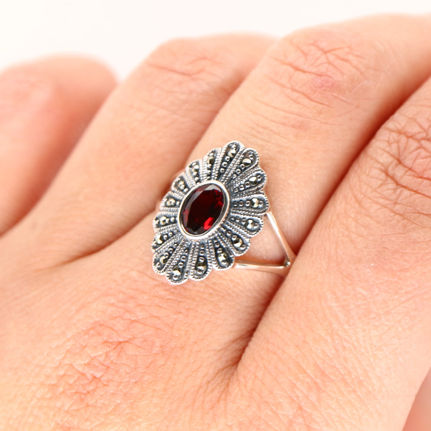 Marcasite shield with garnet ring in sterling silver