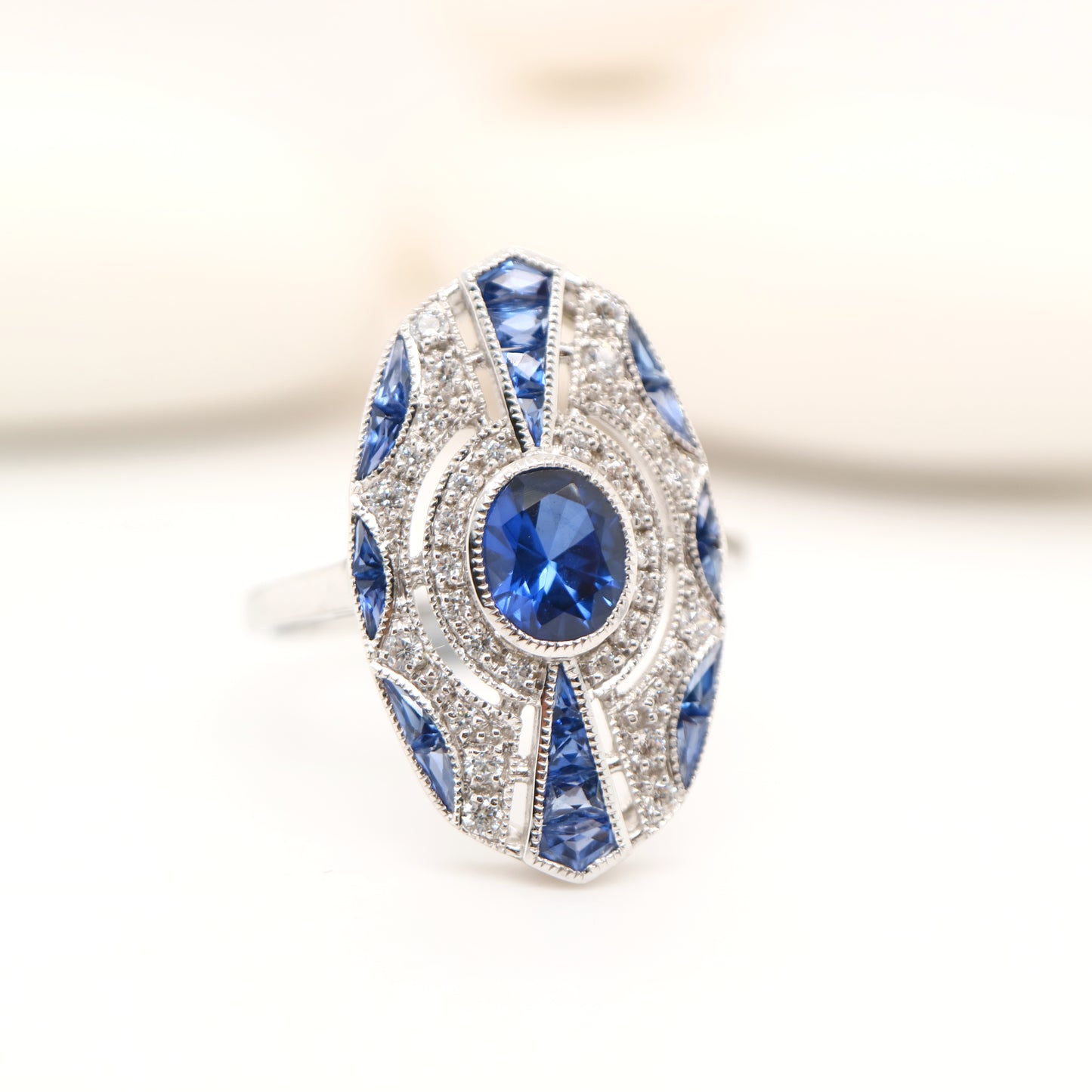 Sterling silver shield ring with Verneuil sapphire and CZ