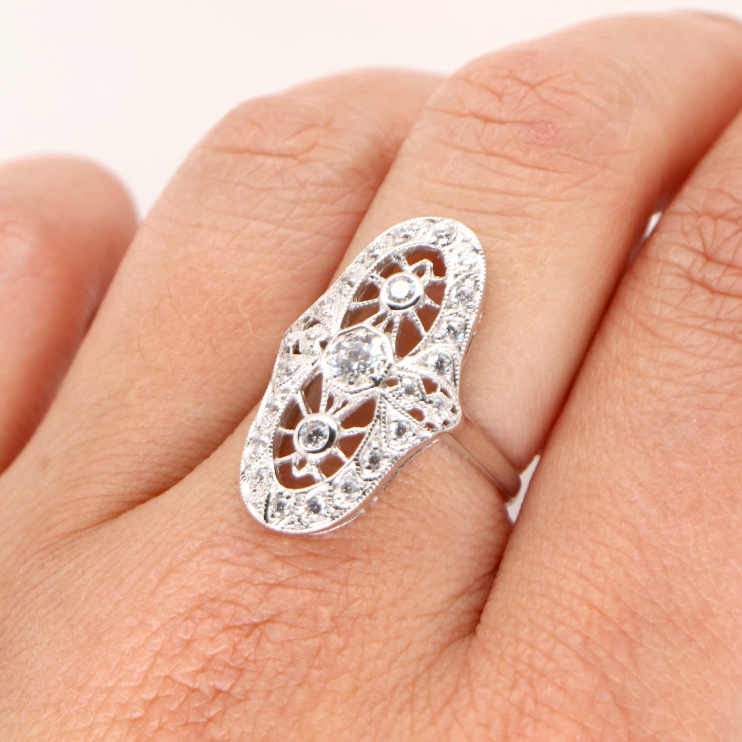 Cocktail halo ring with cubic zirconia in sterling silver