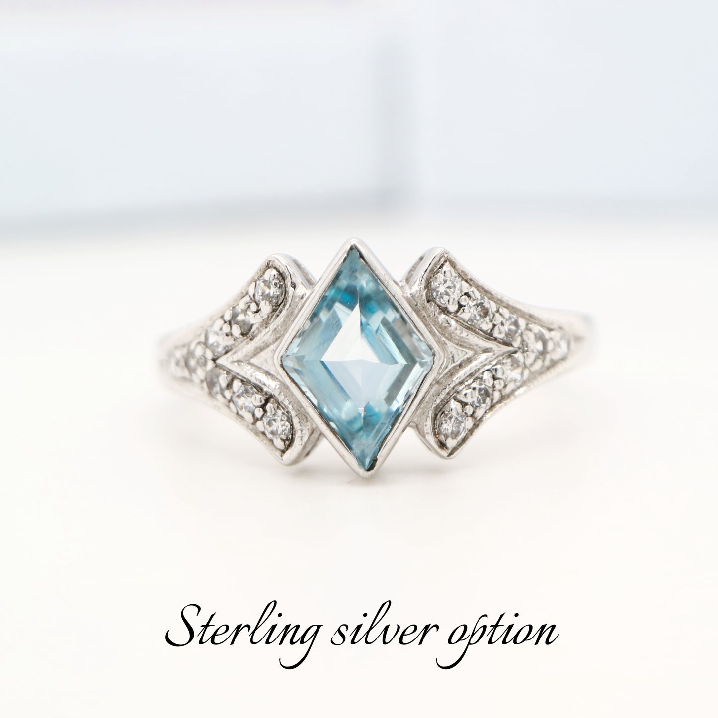 Diamond shape blue topaz with cz in sterling silver