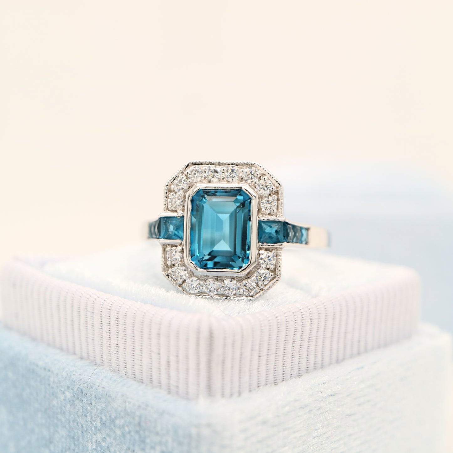 London blue topaz ring in Sterling Silver with CZ halo