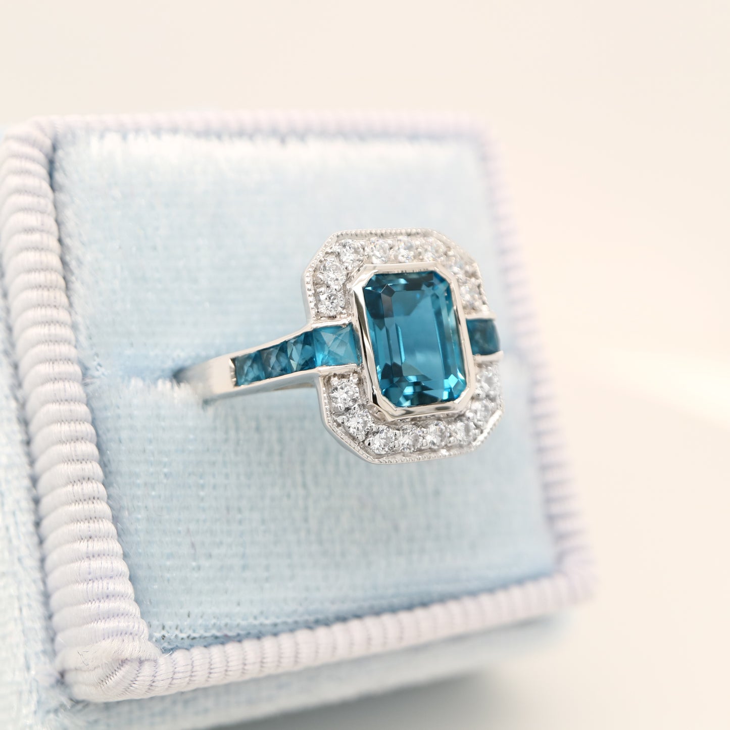 London blue topaz ring in Sterling Silver with CZ halo