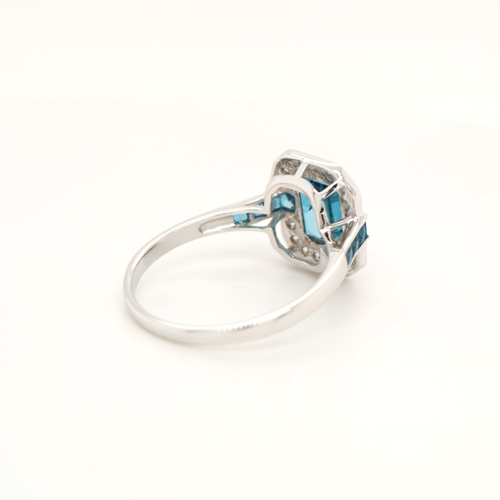 London blue topaz ring in Sterling Silver with CZ halo