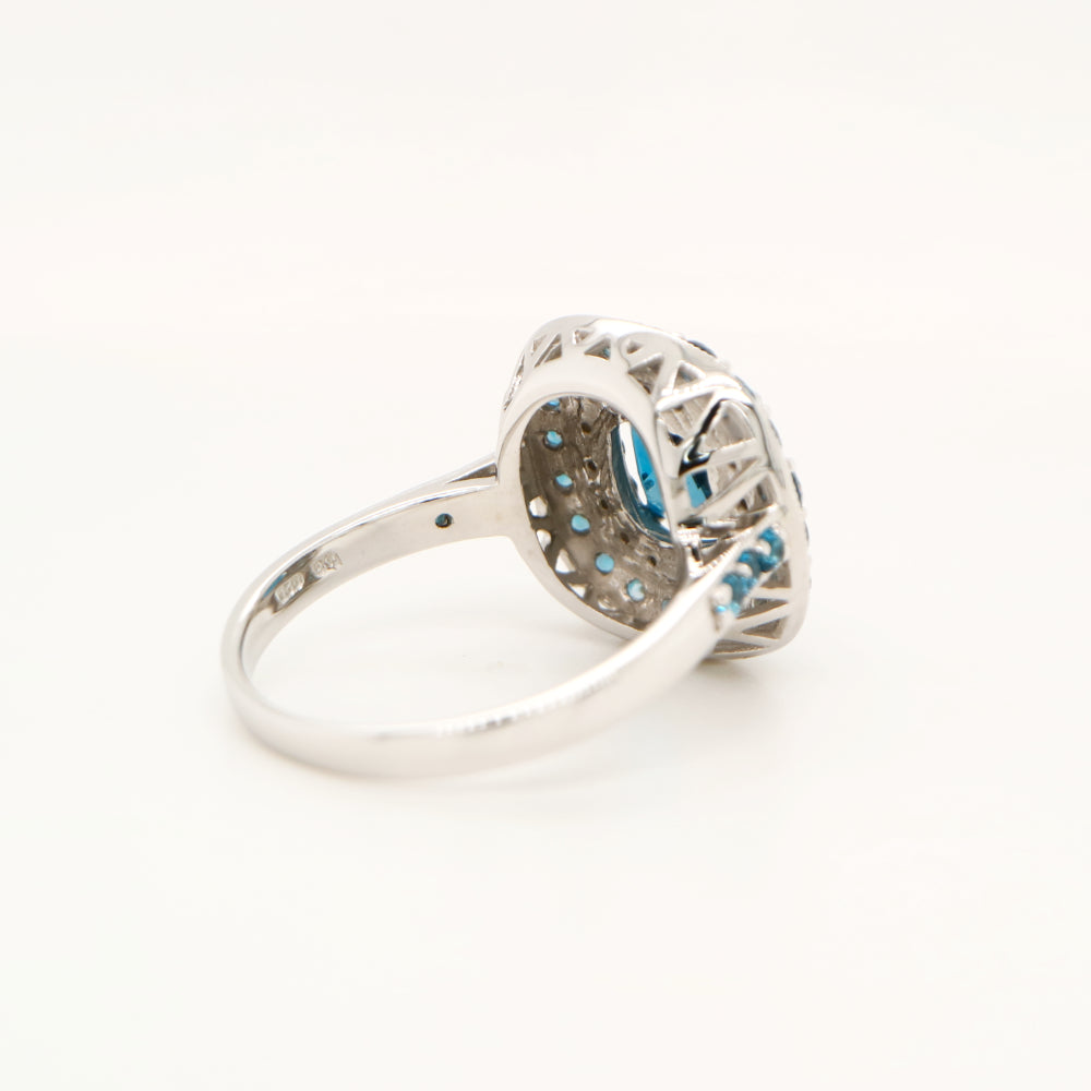 London blue topaz cocktail ring with cz and london blue topaz halo in sterling silver
