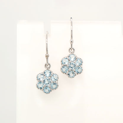 Daisy hook earrings with blue topaz in 9k White gold