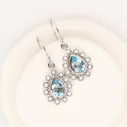 Colonial pearl and sky blue topaz droplet earrings in 9k white gold