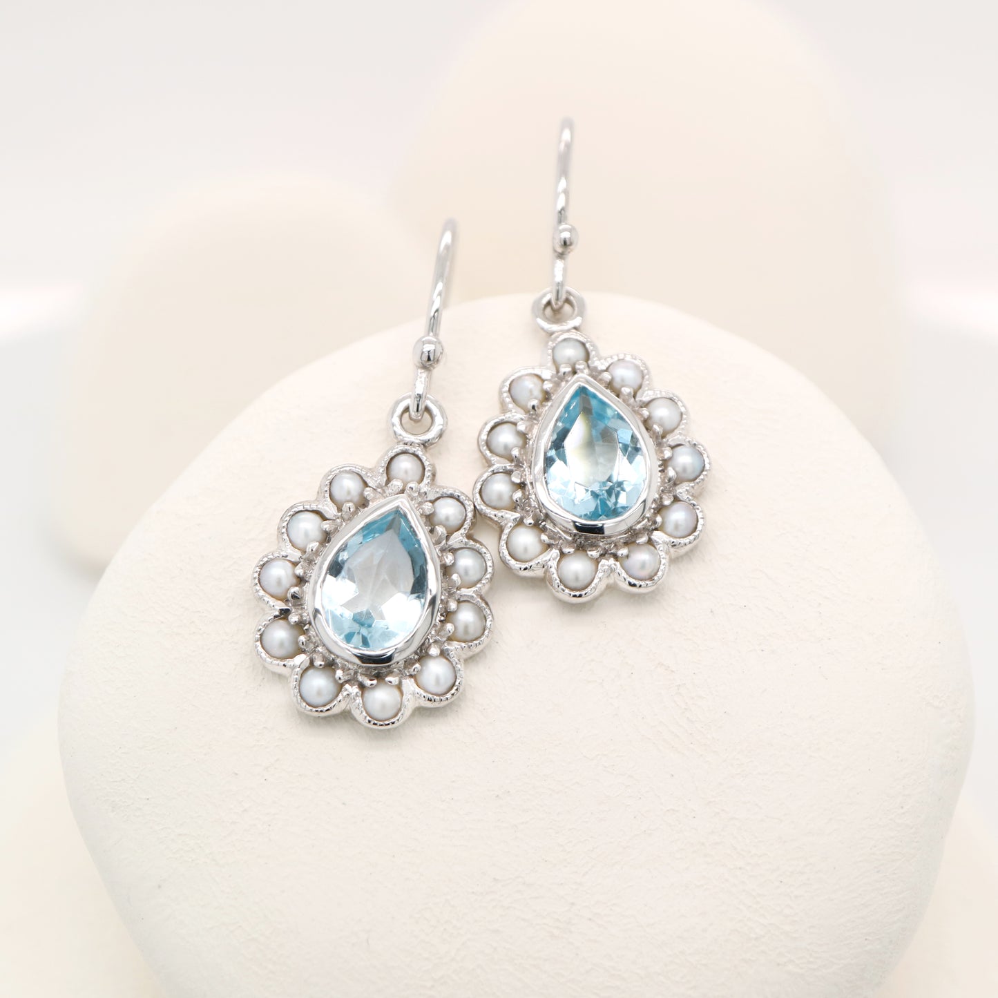 Colonial pearl and sky blue topaz droplet earrings in 9k white gold