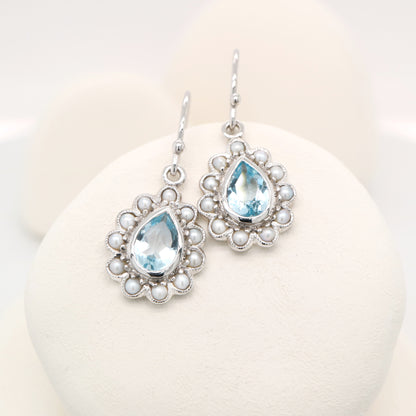 Colonial pearl and sky blue topaz droplet earrings in 9k white gold