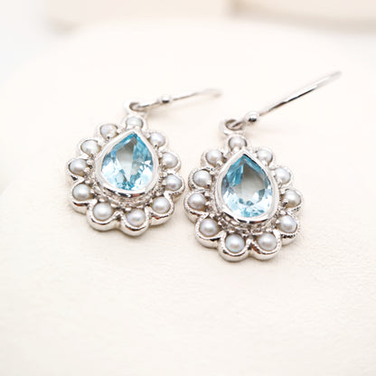 Colonial pearl and sky blue topaz droplet earrings in 9k white gold