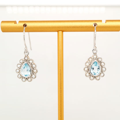 Colonial pearl and sky blue topaz droplet earrings in 9k white gold