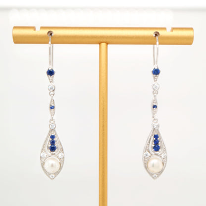Dangle earrings with fresh water pearl, sapphire and diamond in 9k white gold