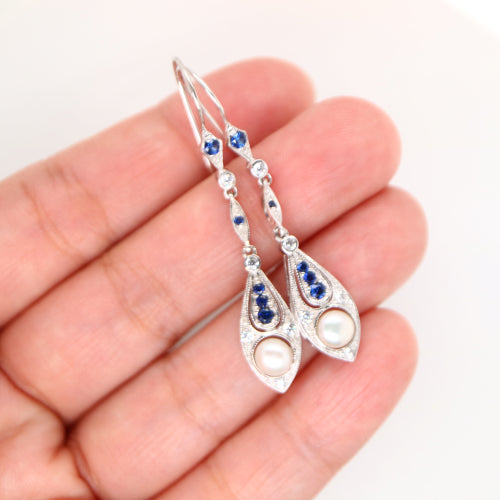 Dangle earrings with fresh water pearl, sapphire and diamond in 9k white gold