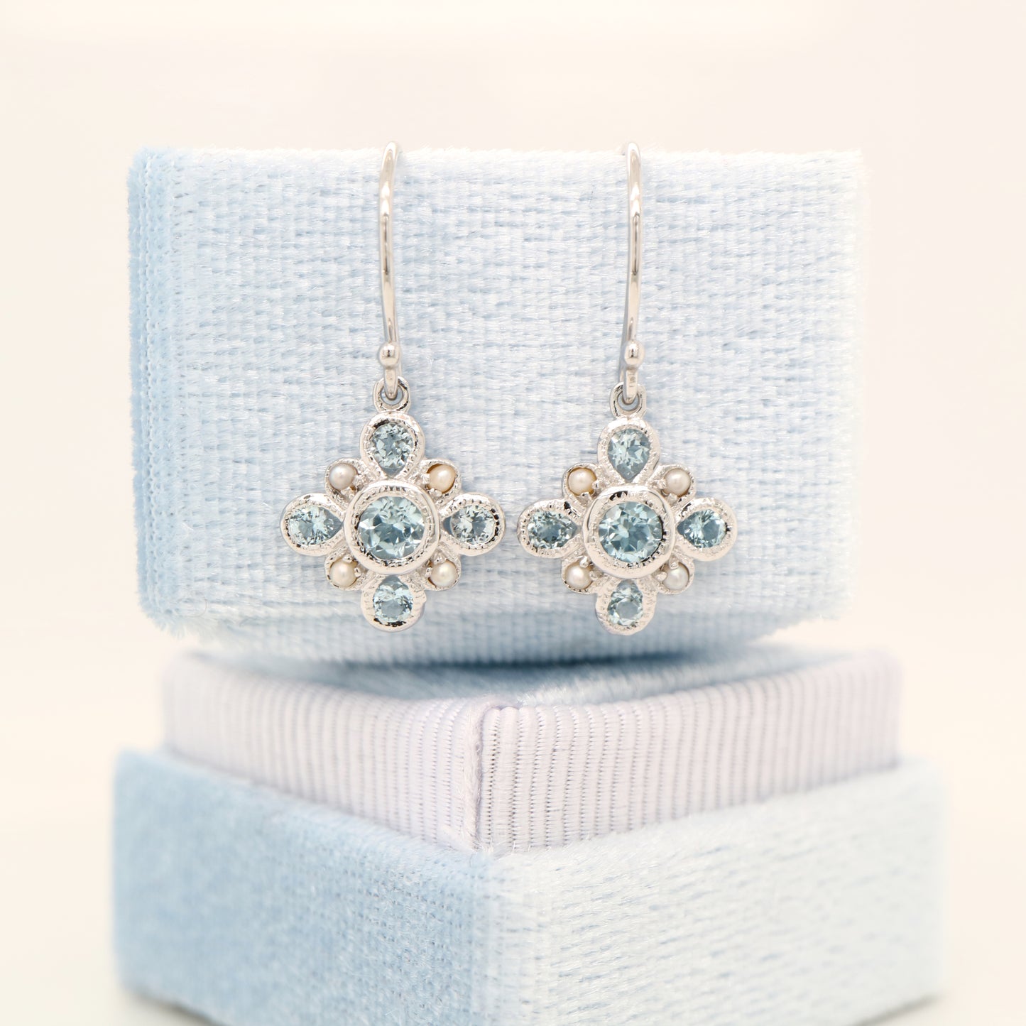 Sky blue topaz drop earrings in 9k white gold