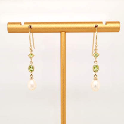 Hook dangle earrings with peridot and freshwater pearl drop in 9k yellow gold