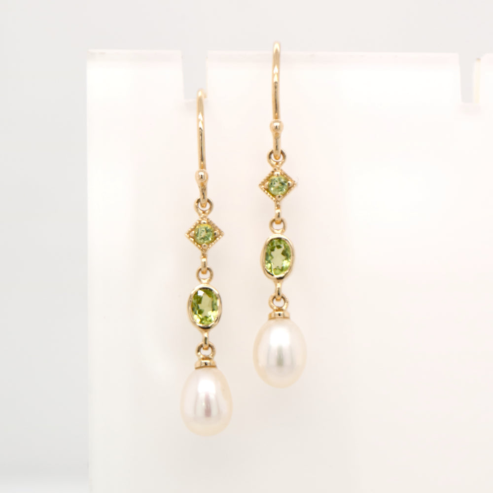 Hook dangle earrings with peridot and freshwater pearl drop in 9k yellow gold