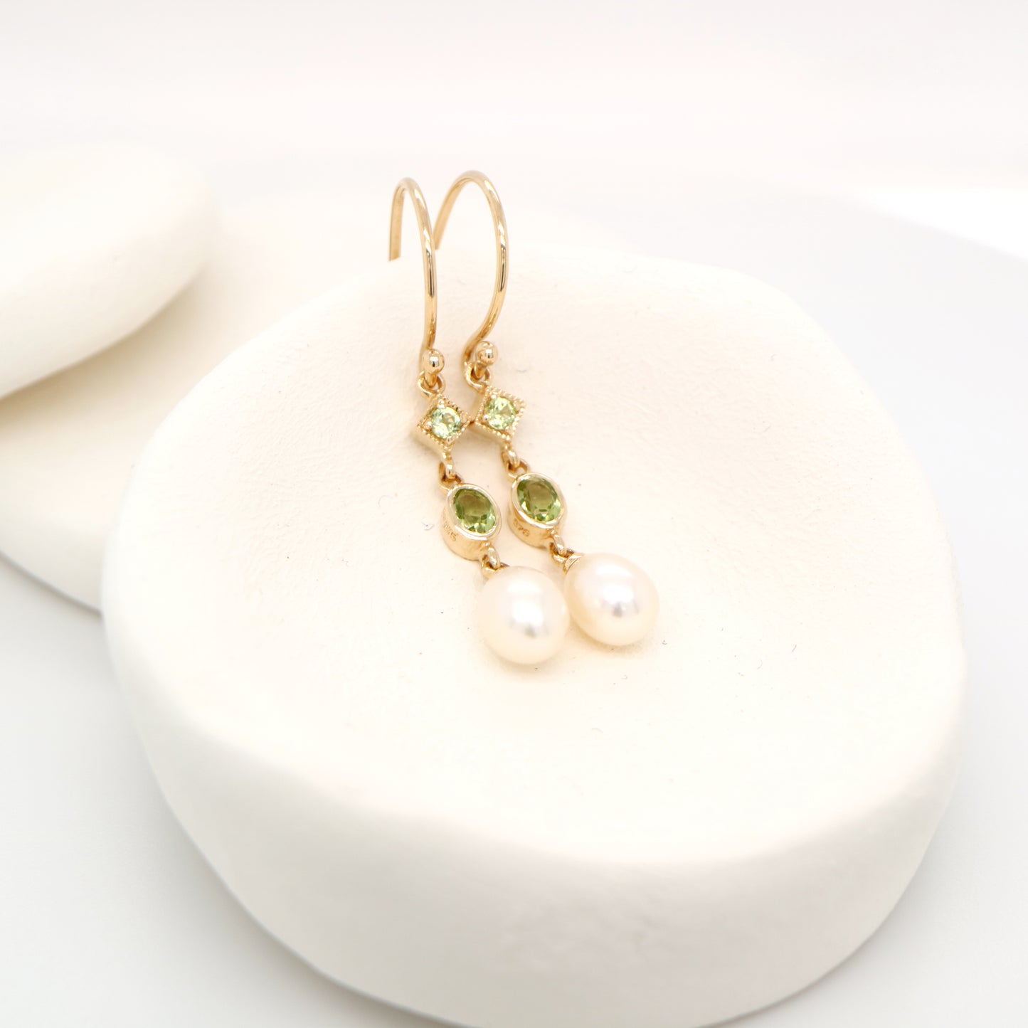 Hook dangle earrings with peridot and freshwater pearl drop in 9k yellow gold