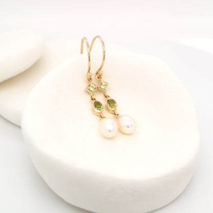 Hook dangle earrings with peridot and freshwater pearl drop in 9k yellow gold