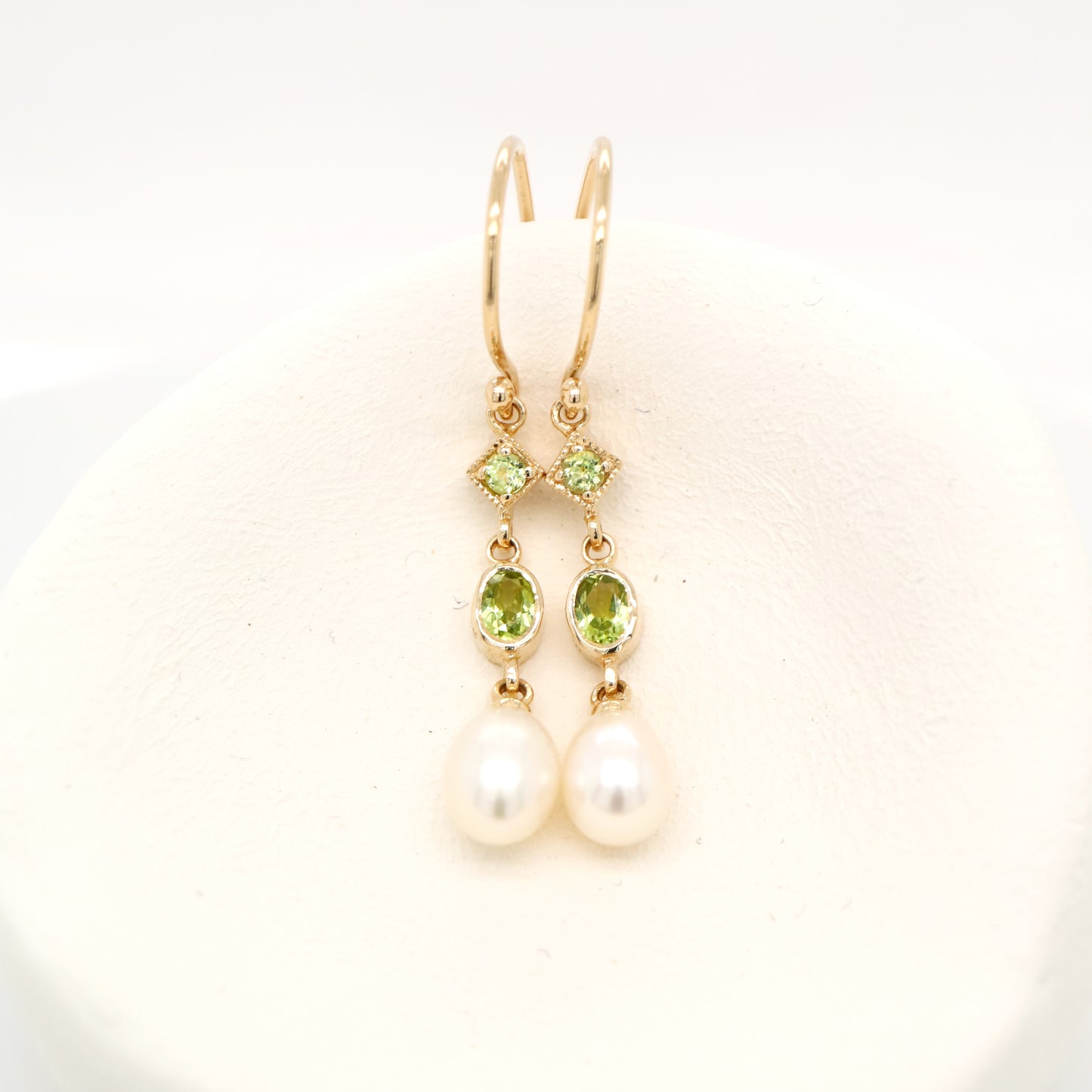 Hook dangle earrings with peridot and freshwater pearl drop in 9k yellow gold