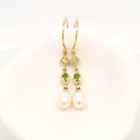 Hook dangle earrings with peridot and freshwater pearl drop in 9k yellow gold