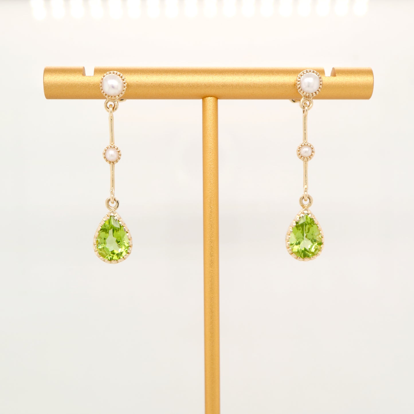 Freshwater pearl with peridot drop earrings in 9k yellow gold