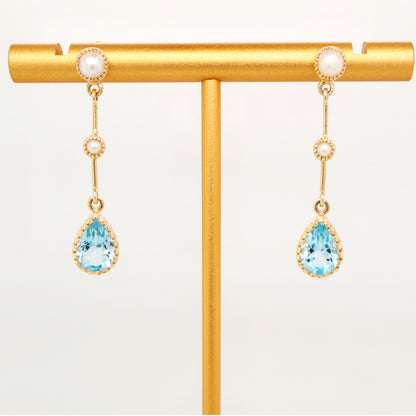 Freshwater pearl with blue topaz drop earrings in 9k yellow gold